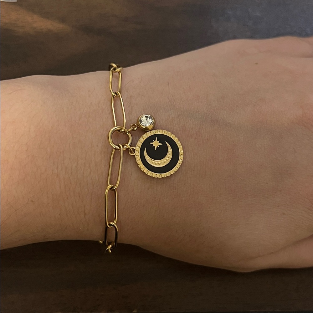 Gold plated stainless steel link bracelet with black moon charm